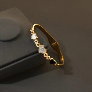 Gold Heart Charm Bangle with Mixed Embellishments